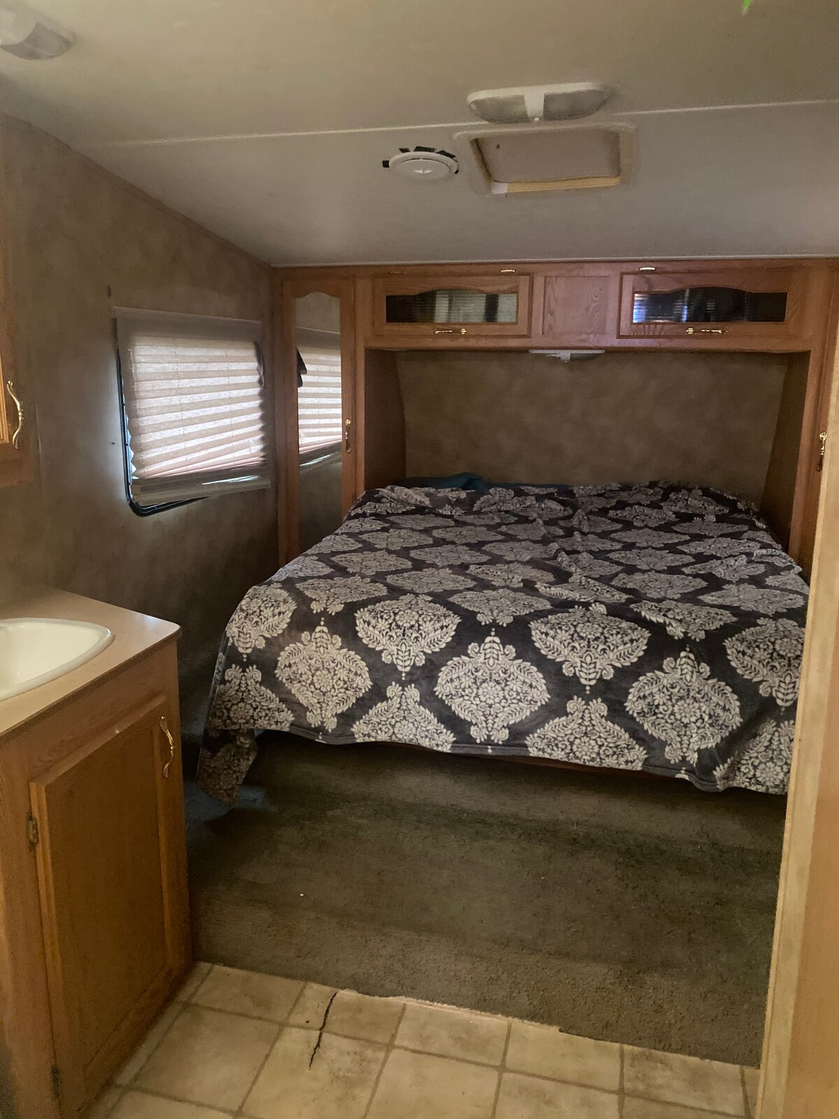 I bedroom cozy RV in country.