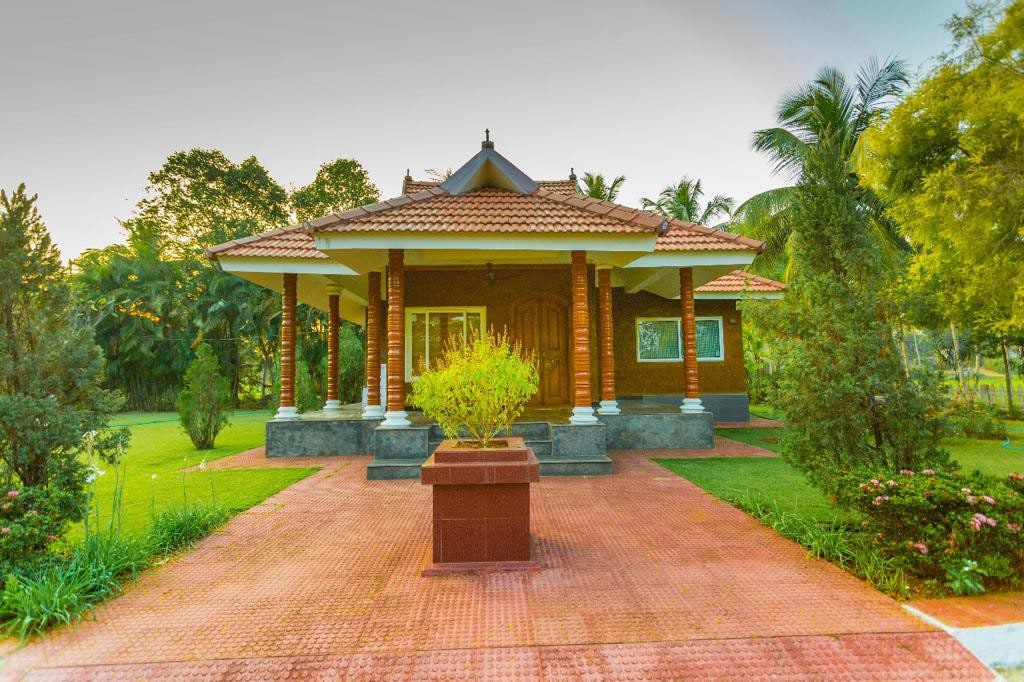 Relax in cozy cottages at Vayaloram Farm House - 1