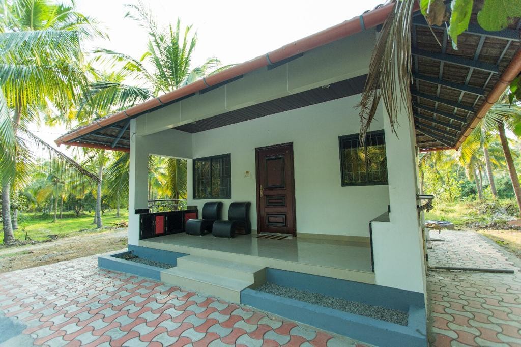 Relax in cozy cottages at Vayaloram Farm House - 1