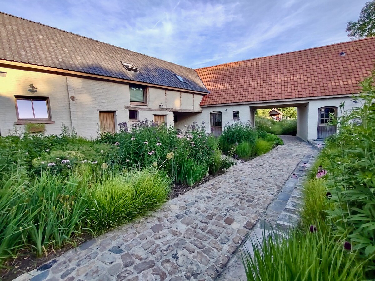 A cozy house, surrounded by an idyllic setting