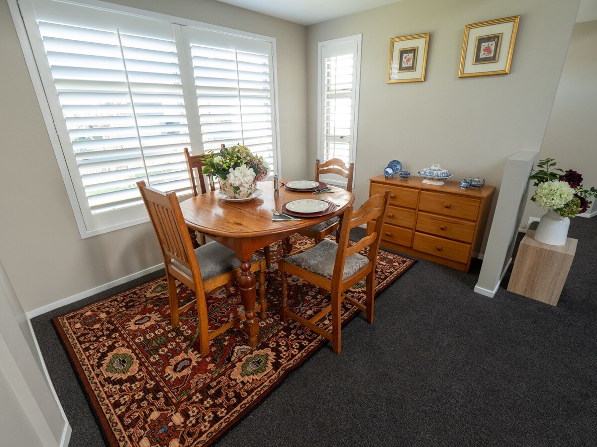 Comfortable bedroom with cozy outdoor dining.