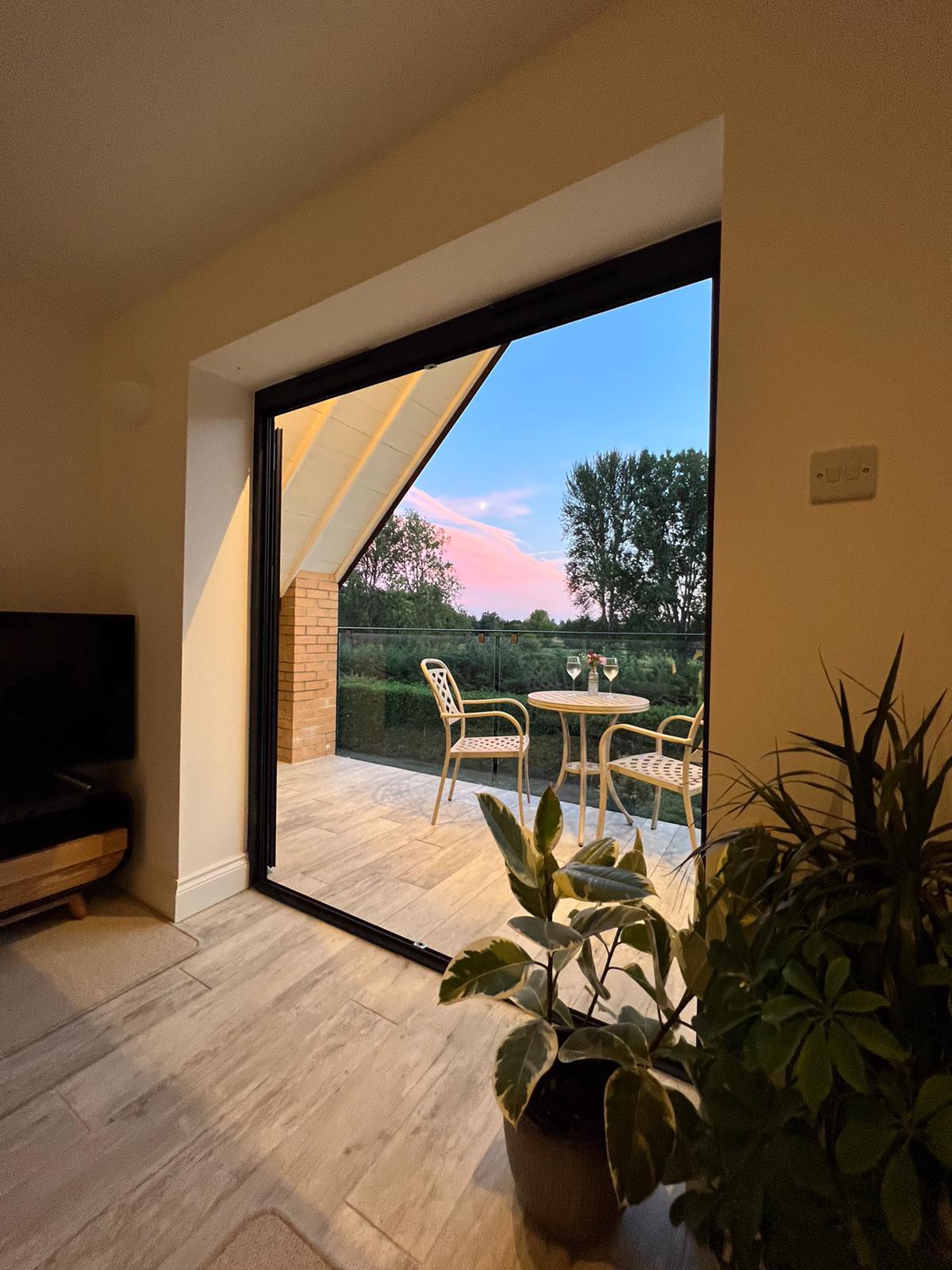 Modern apartment with balcony views of River Lark.