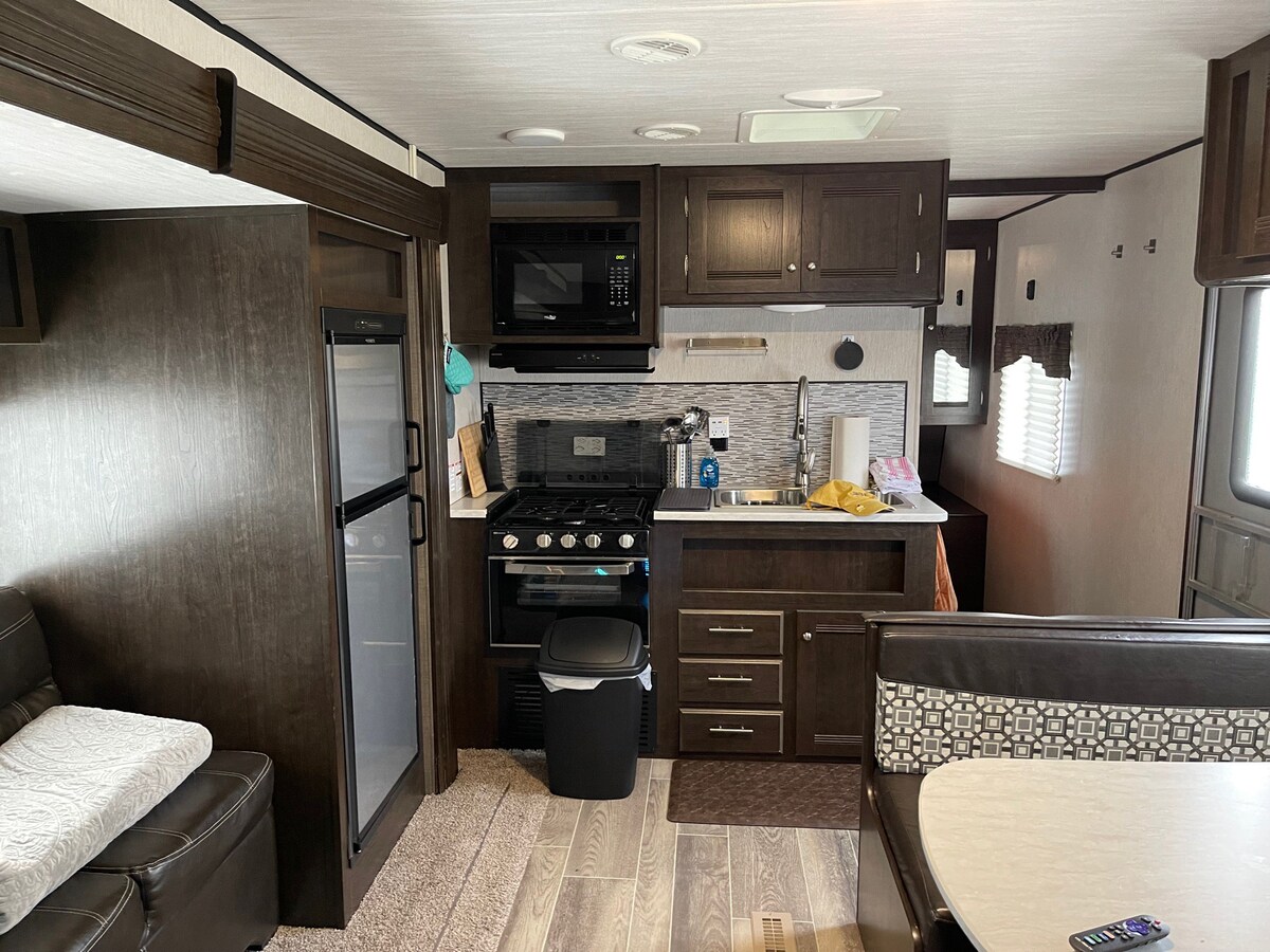 Delightful RV with campground amenities.
