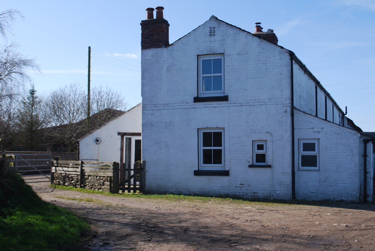 Riverside rustic farm cottage.