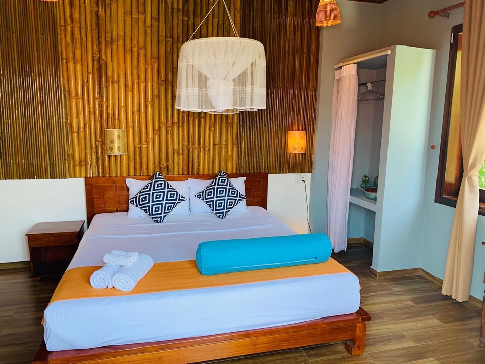 Cheerful room with balcony in beach villa