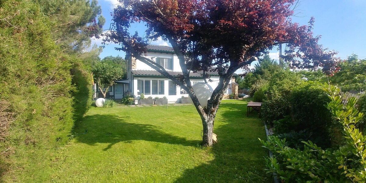 House with garden in beautiful mountain landscape.