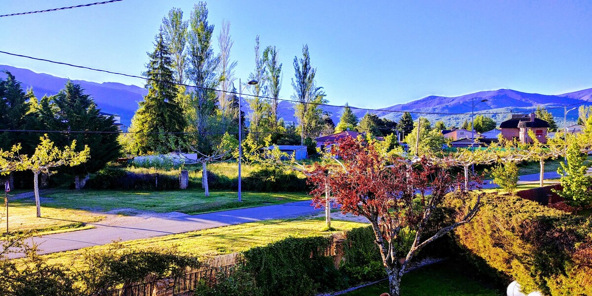 House with garden in beautiful mountain landscape.