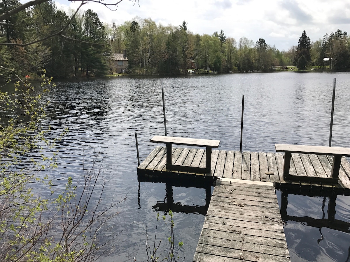 Lakefront cottage on a small quiet no wake lake .