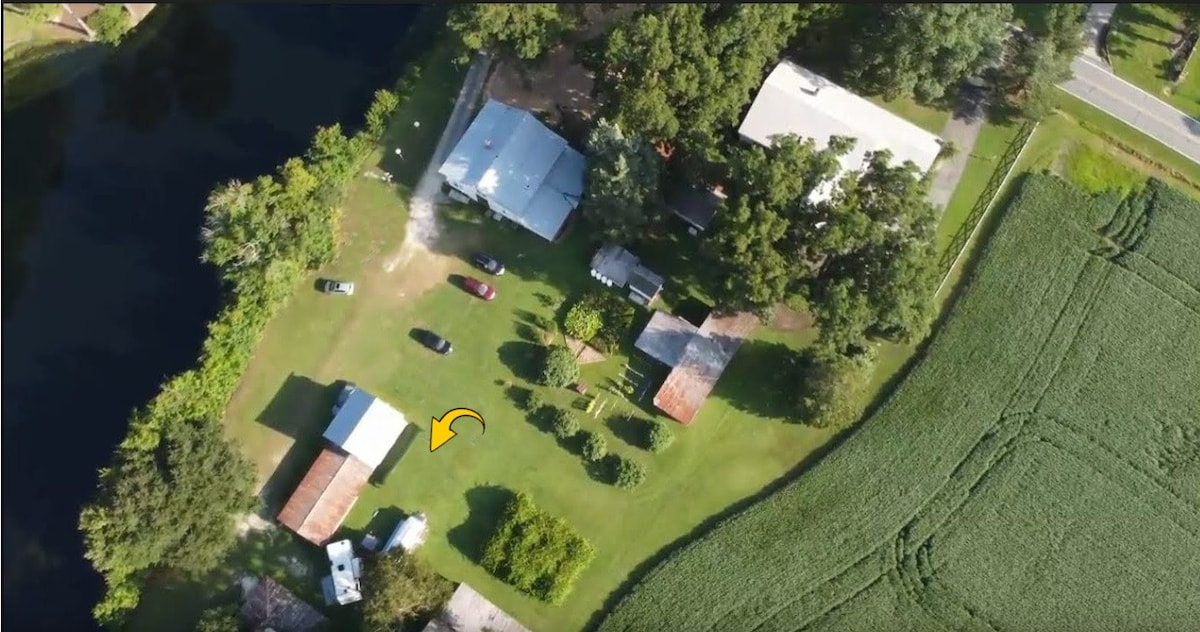 Scenic RV Site Overlooks Lake and Orchard