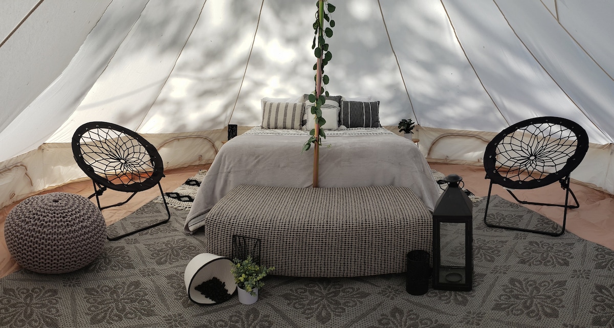 Meadow tent with scenic mountain views
