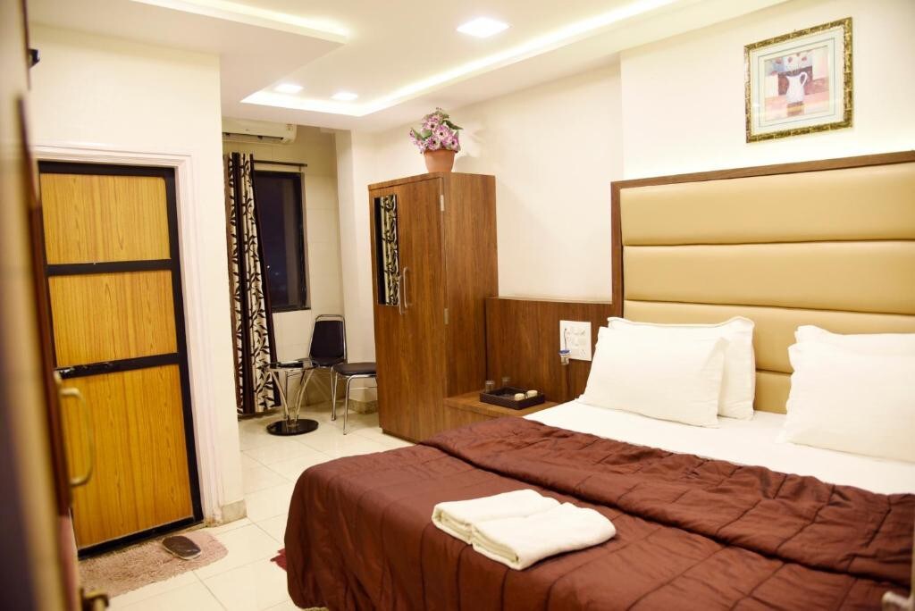 Double Bed Temple Facing ACRoomIn Hotel Sai Yatri