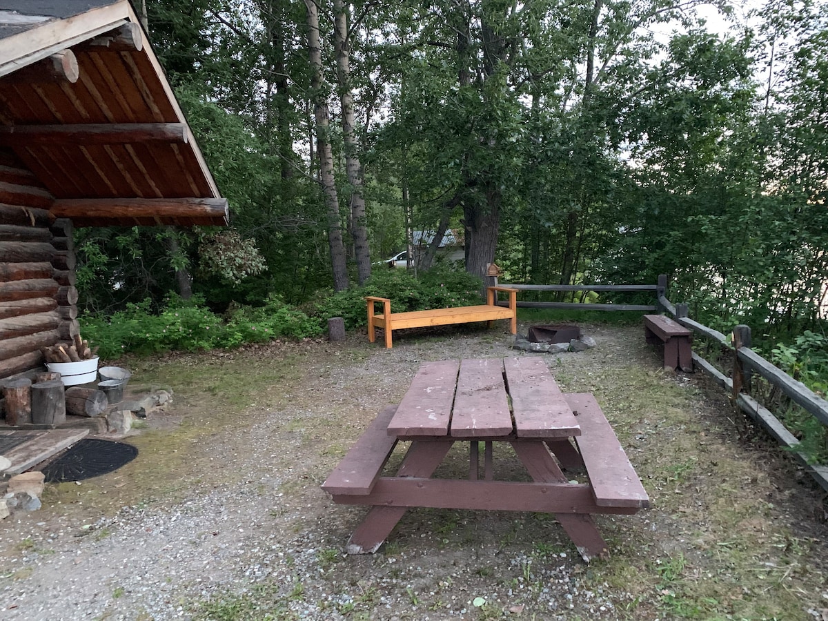 Historical Ferryman cabin on River in Alaska