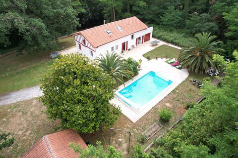 Typical house on the edge of the forest with pool