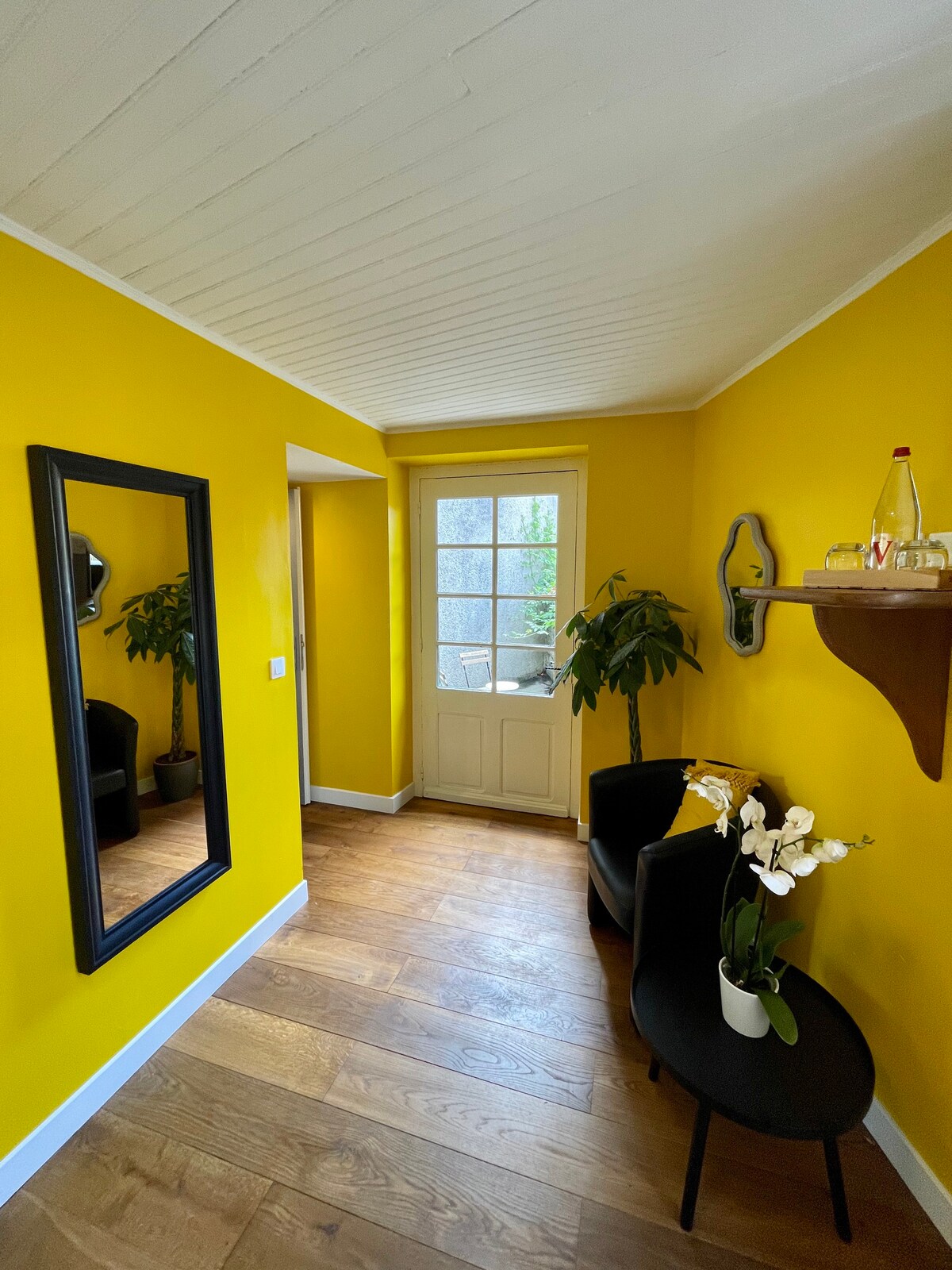 Luminous bedroom in boutique hotel with patio