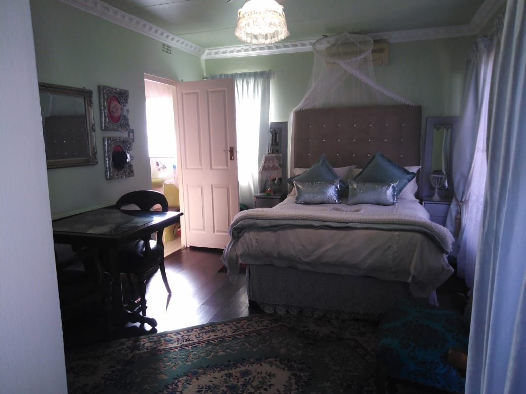 Double Bed and Bathroom in Established Guesthouse