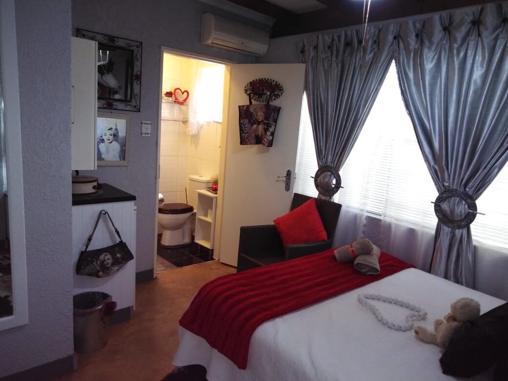 Double Bed and Bathroom in Established Guesthouse