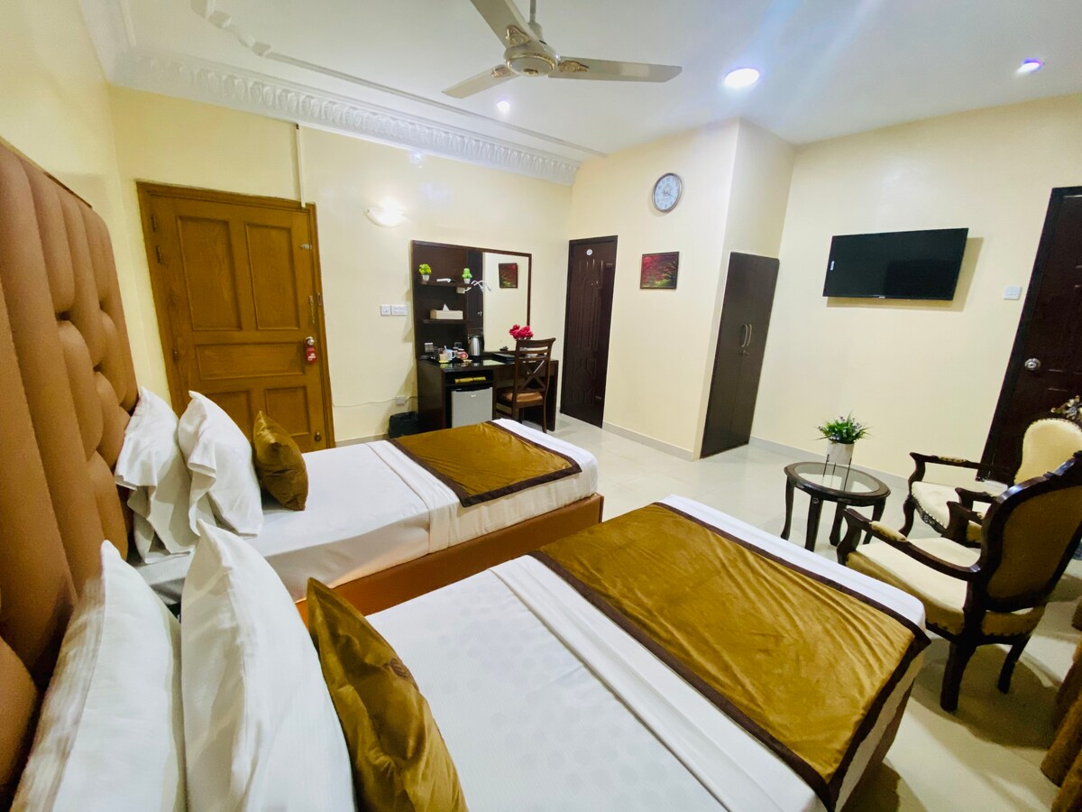 Adorable Large Twin Bed Room at World Inn Karachi.