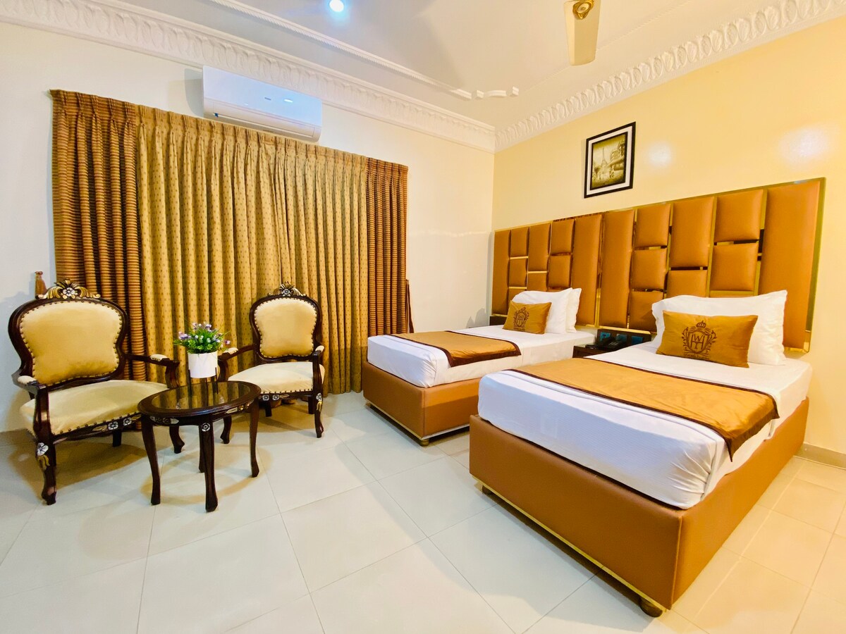 Adorable Large Twin Bed Room at World Inn Karachi.