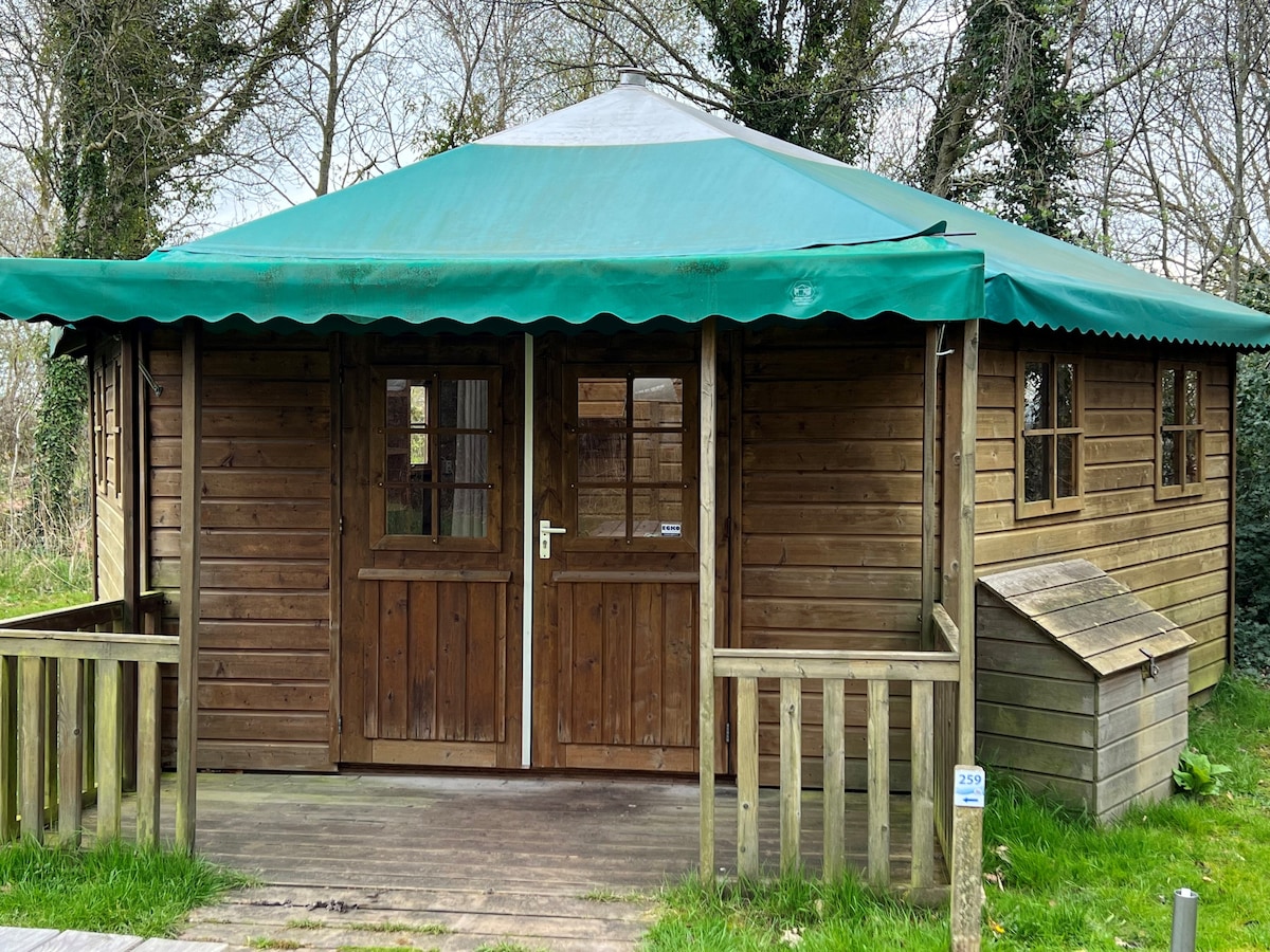 Wooden camping bungalow, in the dunes, by the sea