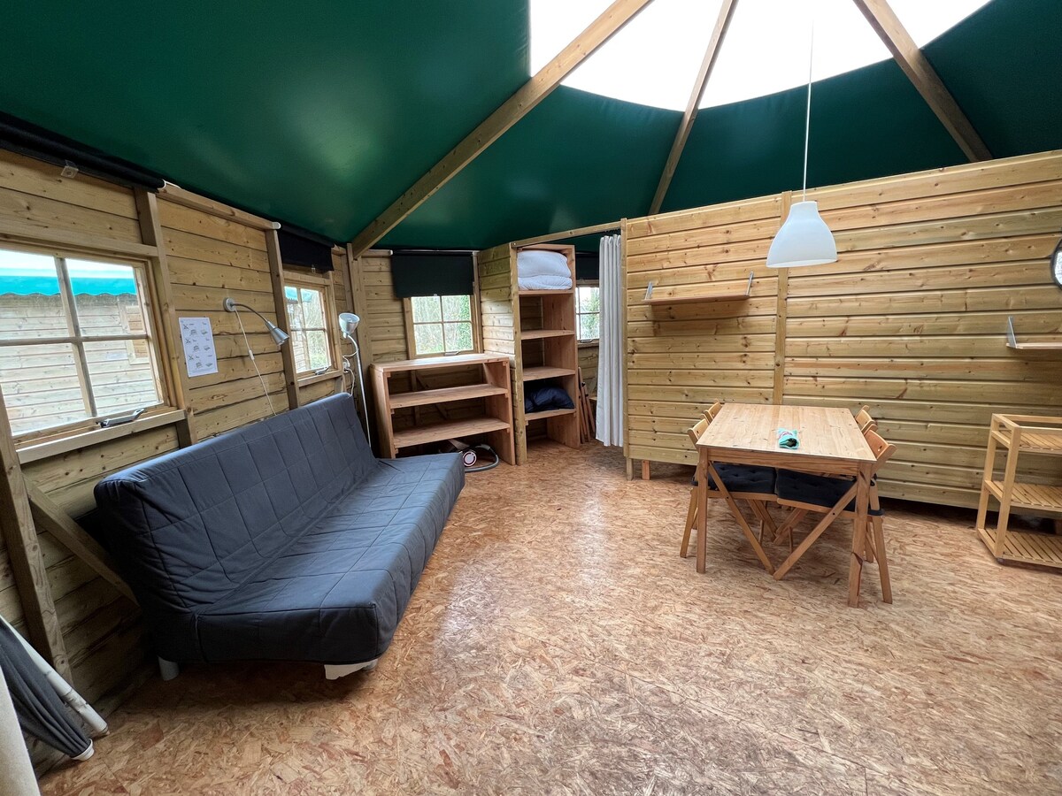 Wooden camping bungalow, in the dunes, by the sea