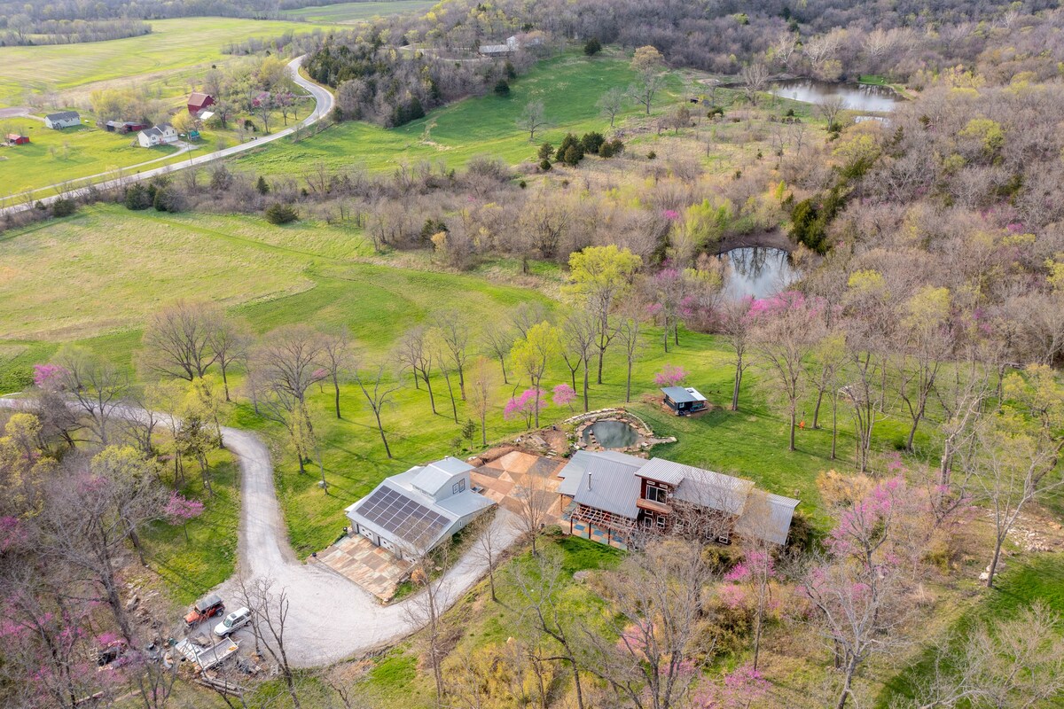 Modern home on 10 acres with natural swimming pool