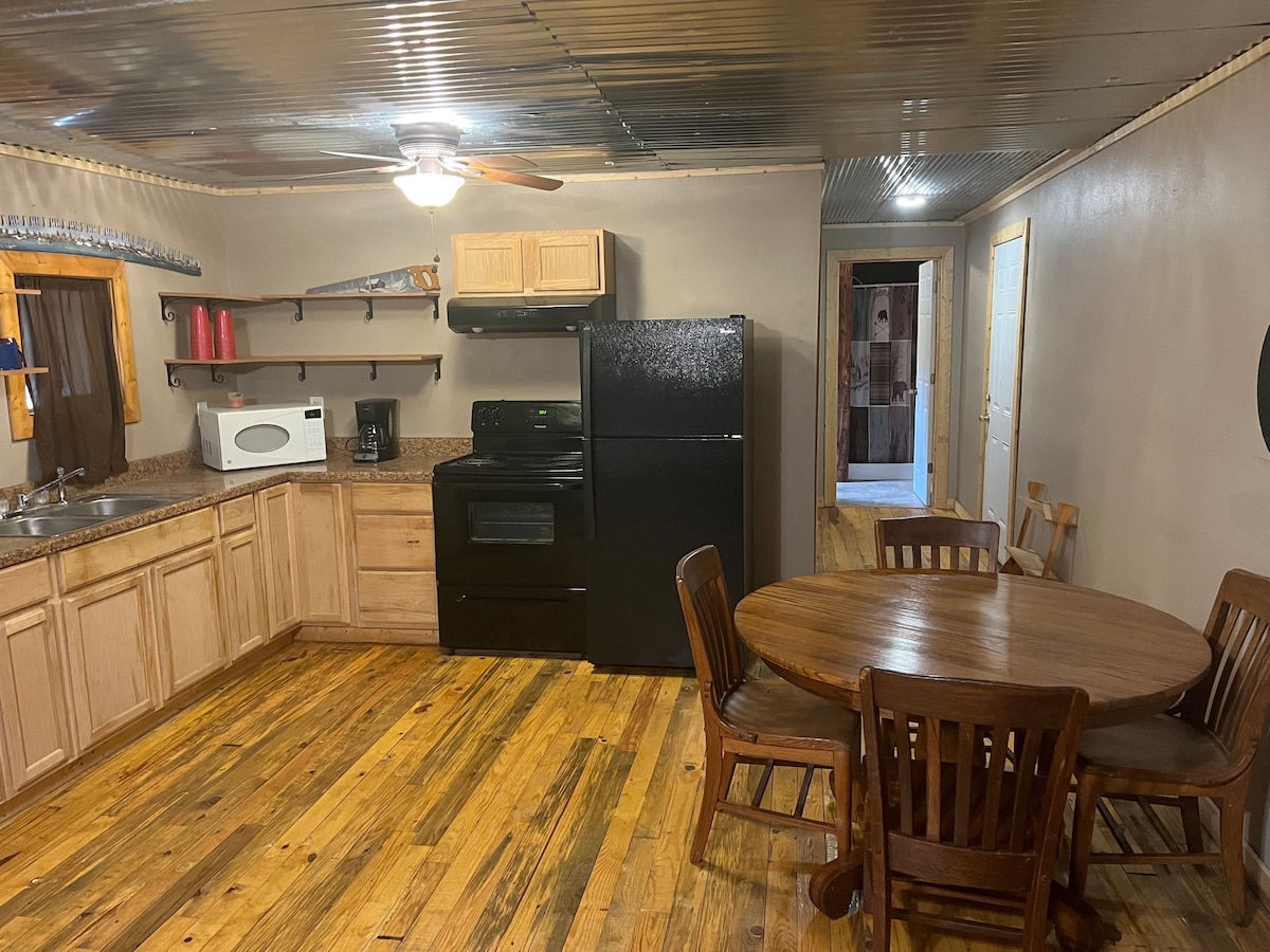 1br Cabin set against the Ozark National Forest