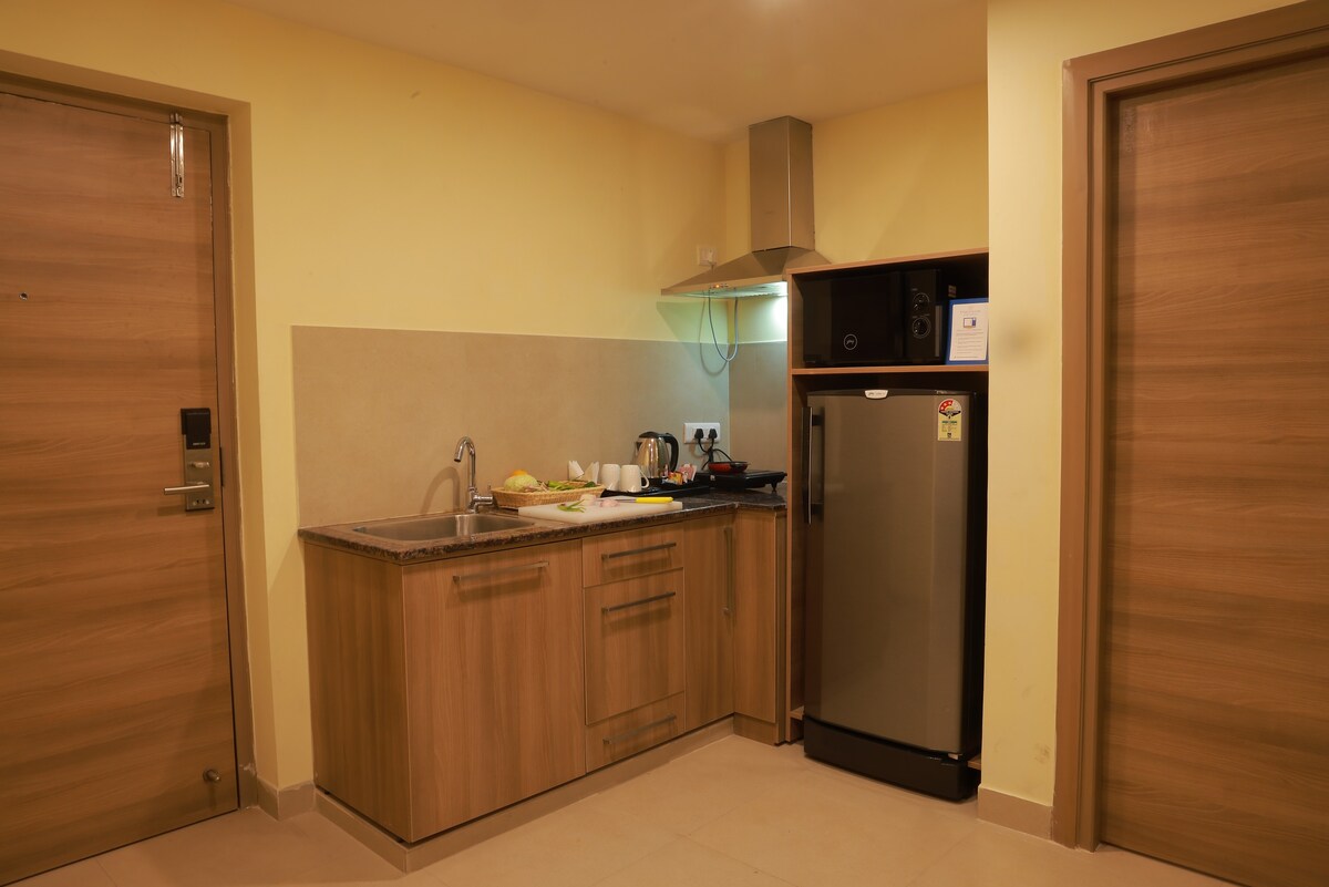 Premium 2 BHK Room kitchenette Tirupati City View