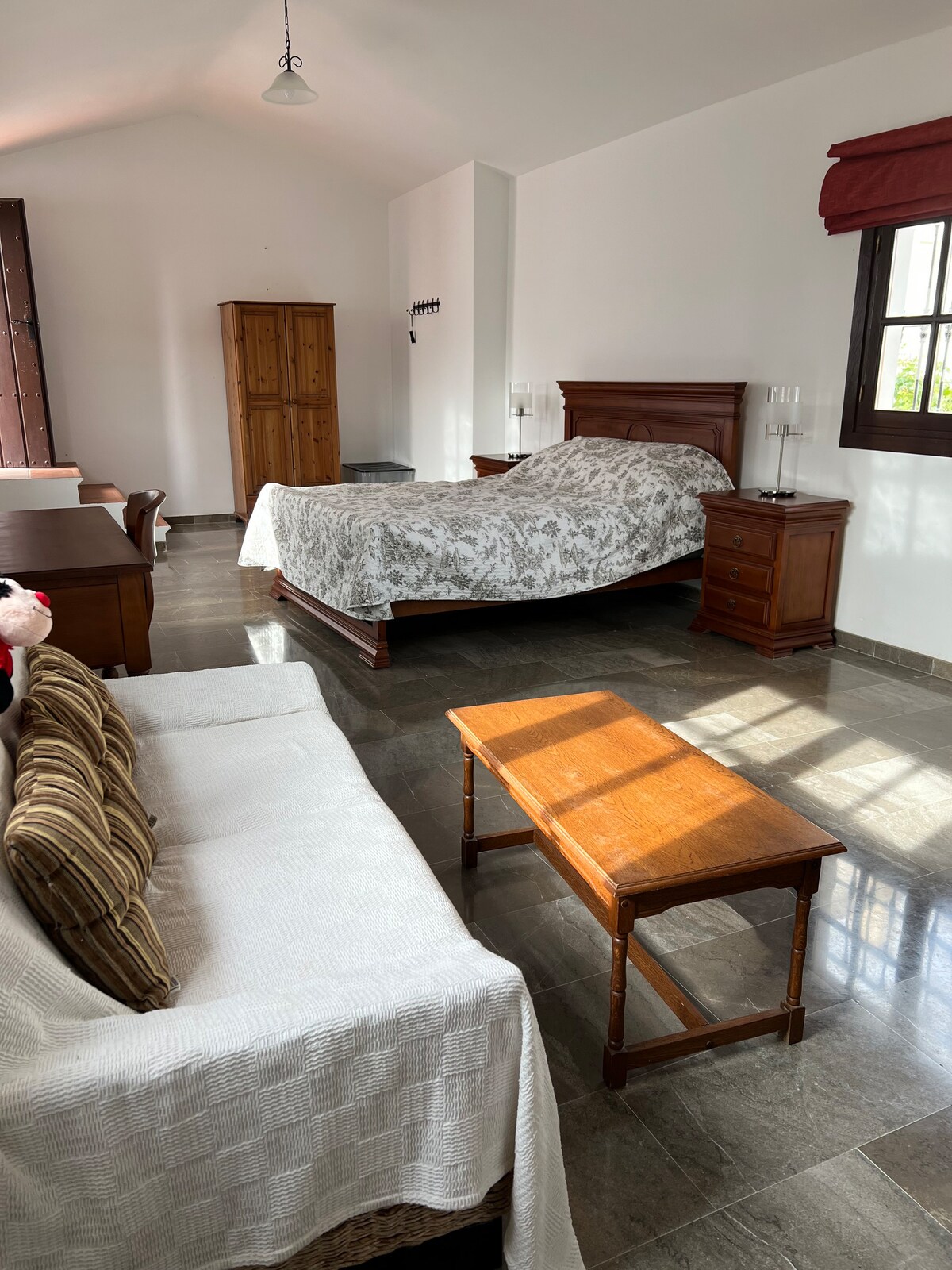 Private room set in traditional Spanish townhouse.