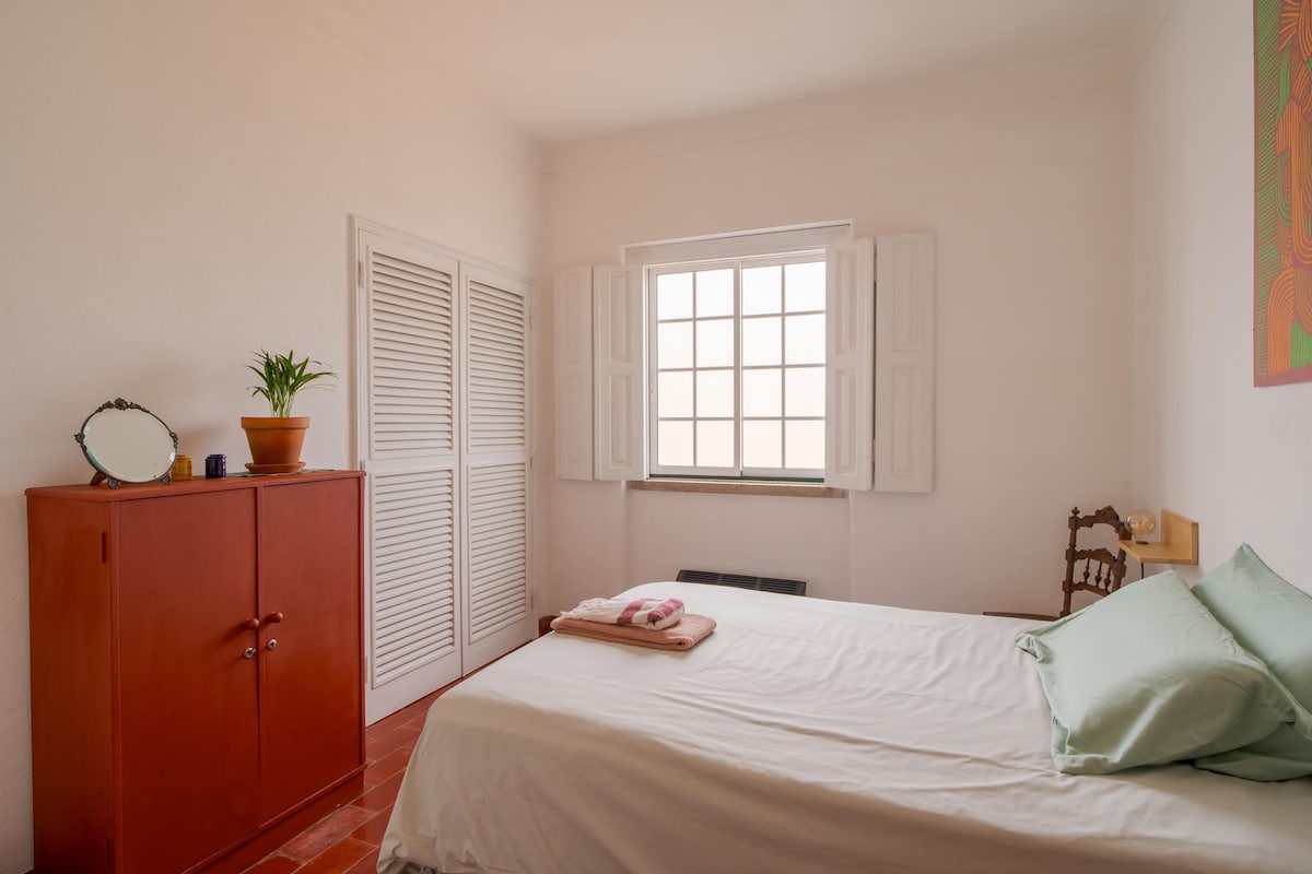 Single bedroom with terrace views