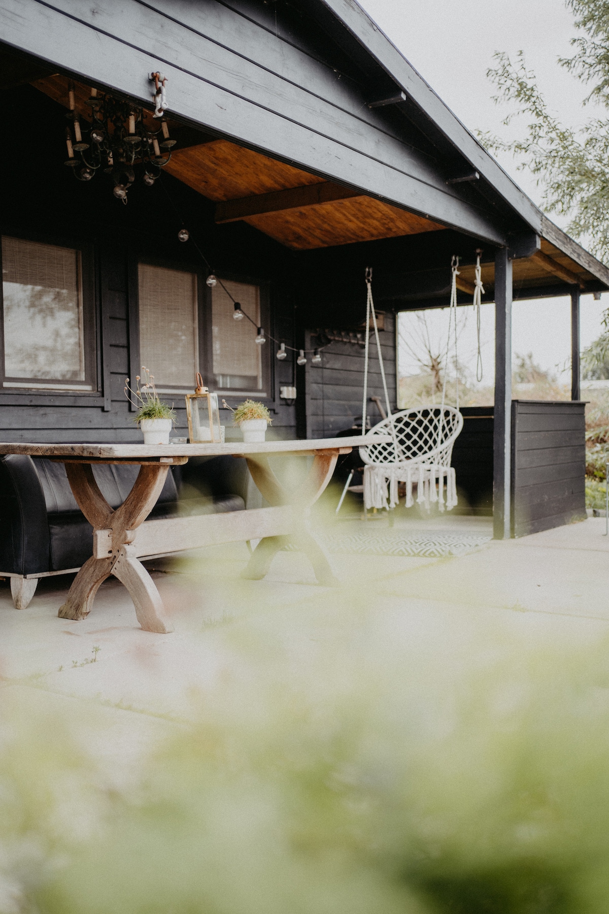 Wooden cabin with bikes and rowing boats