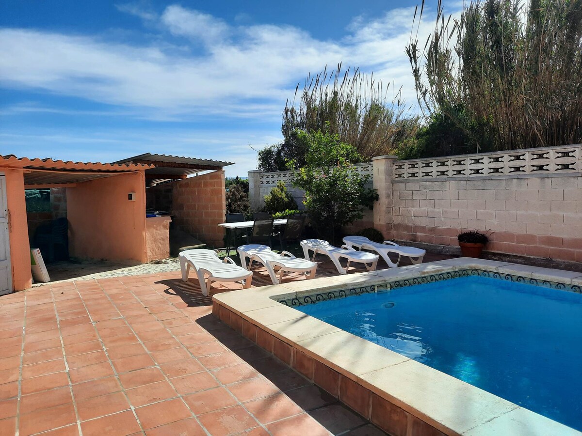 Private villa with heated pool close to the beach.