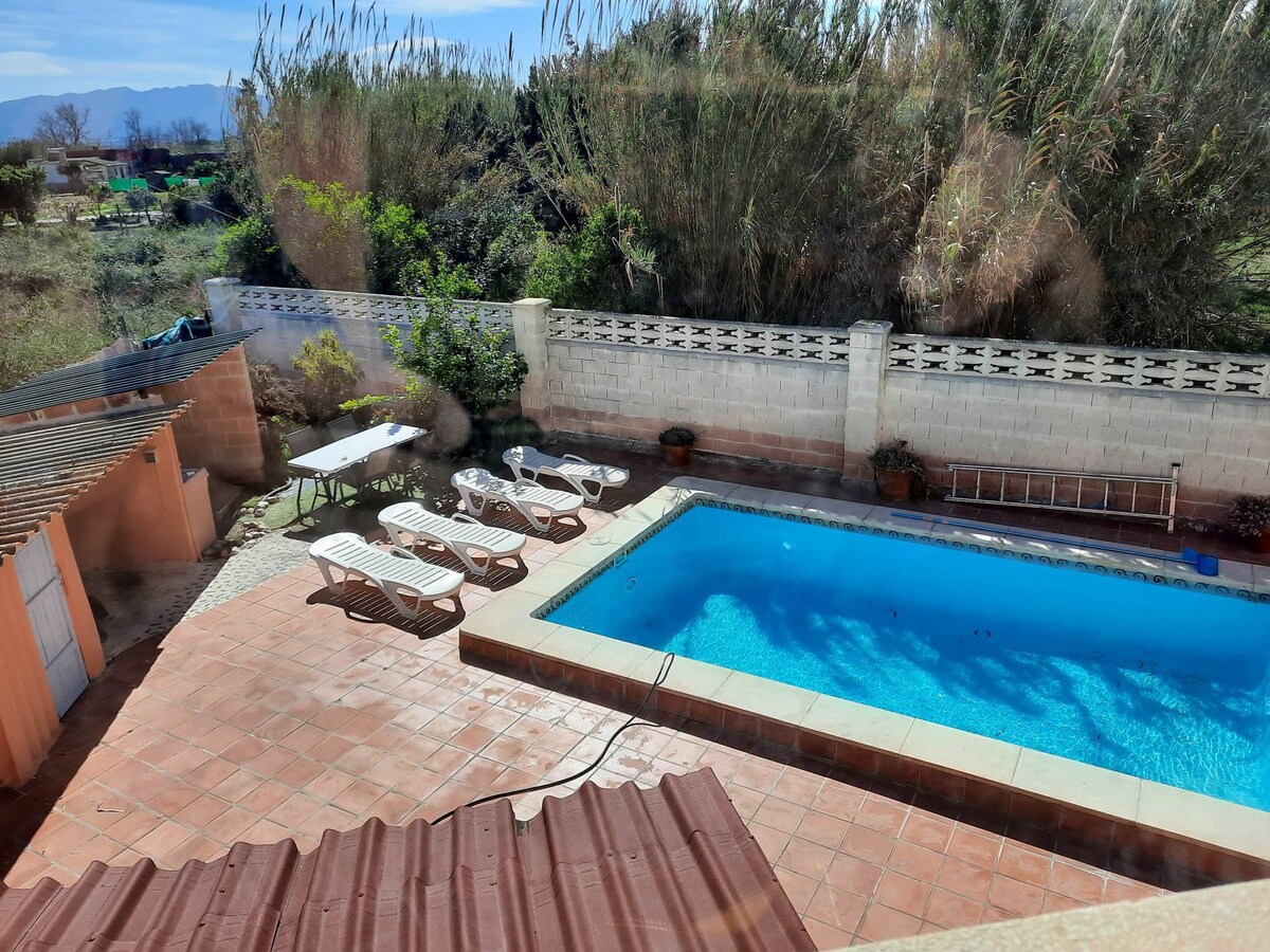 Private villa with heated pool close to the beach.