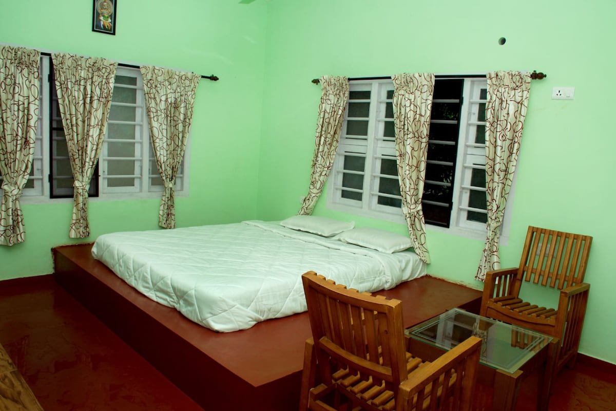 Private AC room in traditional Kerala house