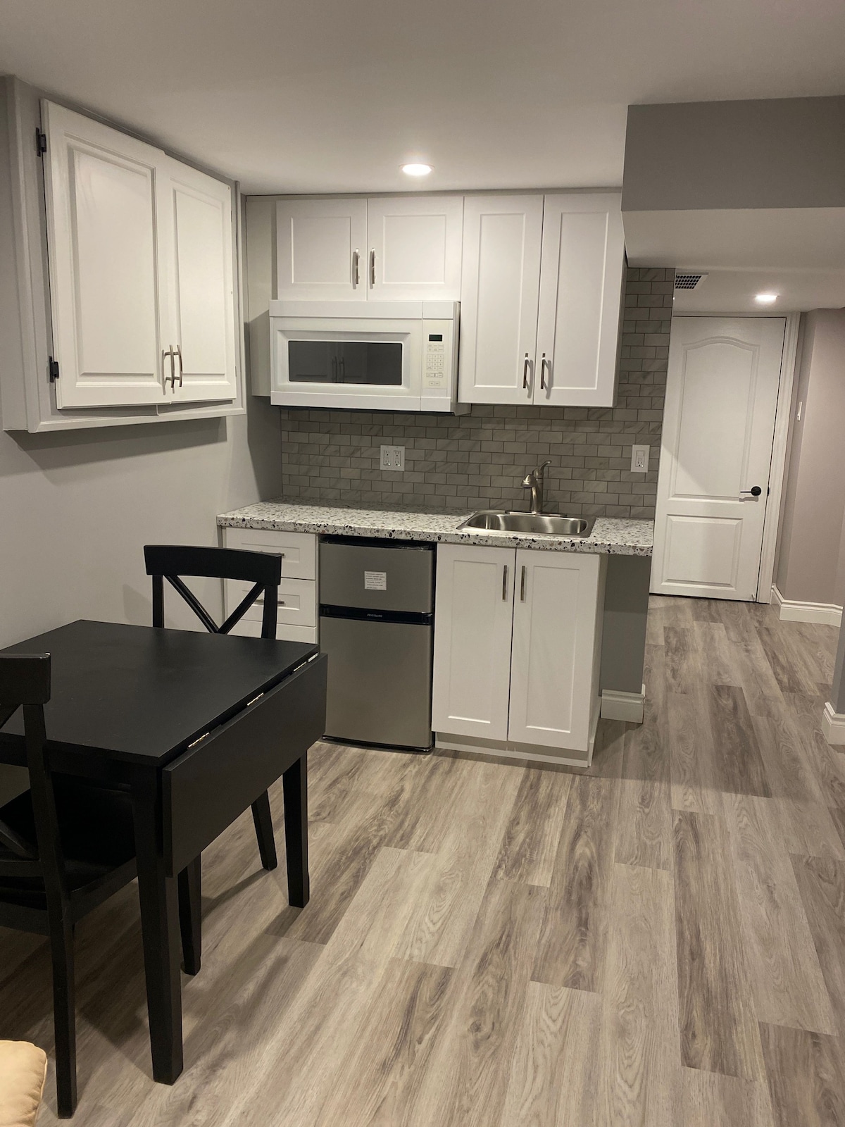 Basement suite with kitchenette.