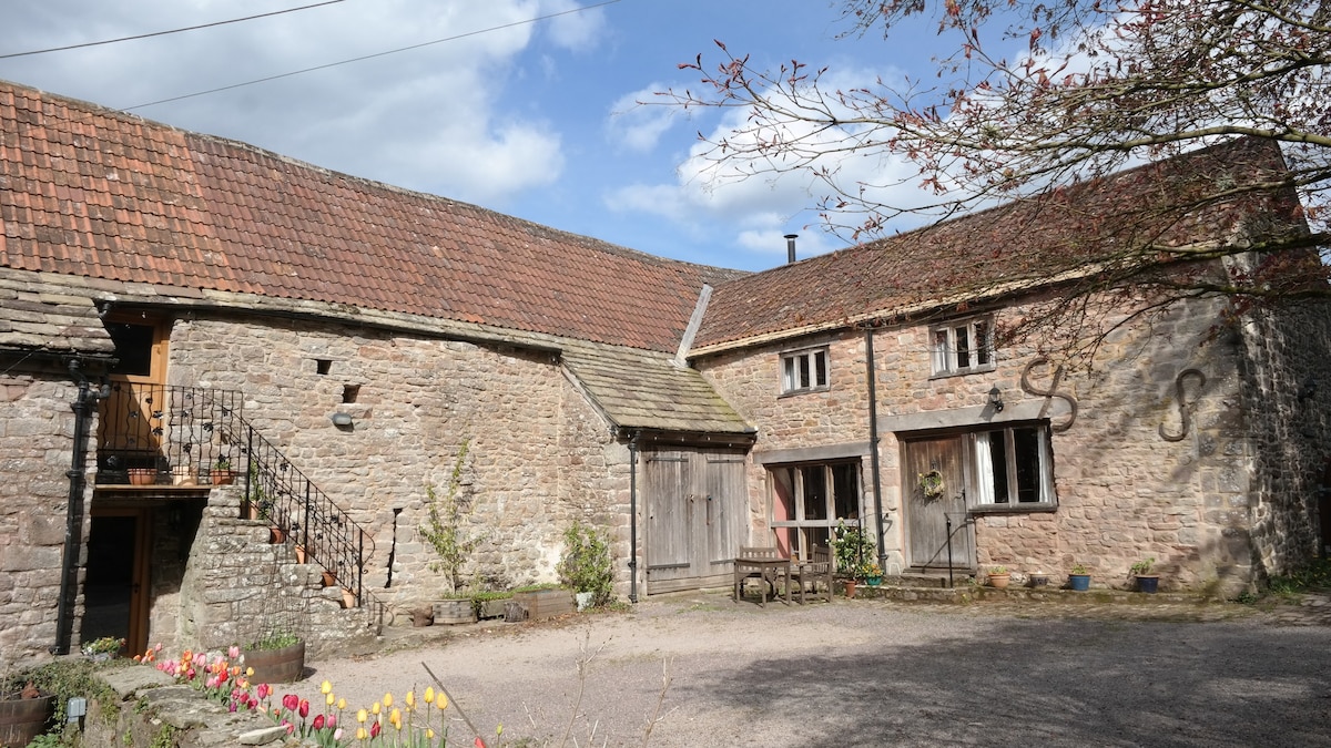 Converted stables and hayloft in former farmyard