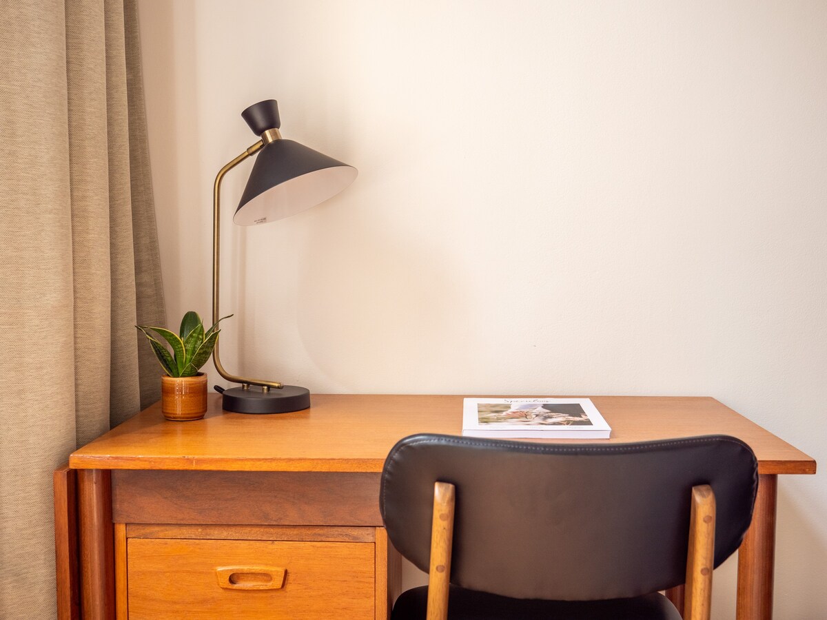 Spacious bedroom with vintage desk