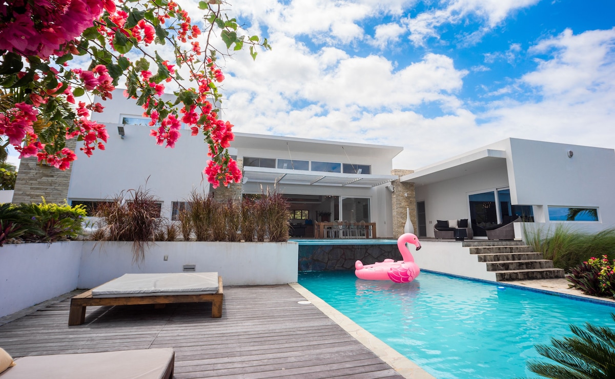 Caribbean-style with 2-level pool & large garden