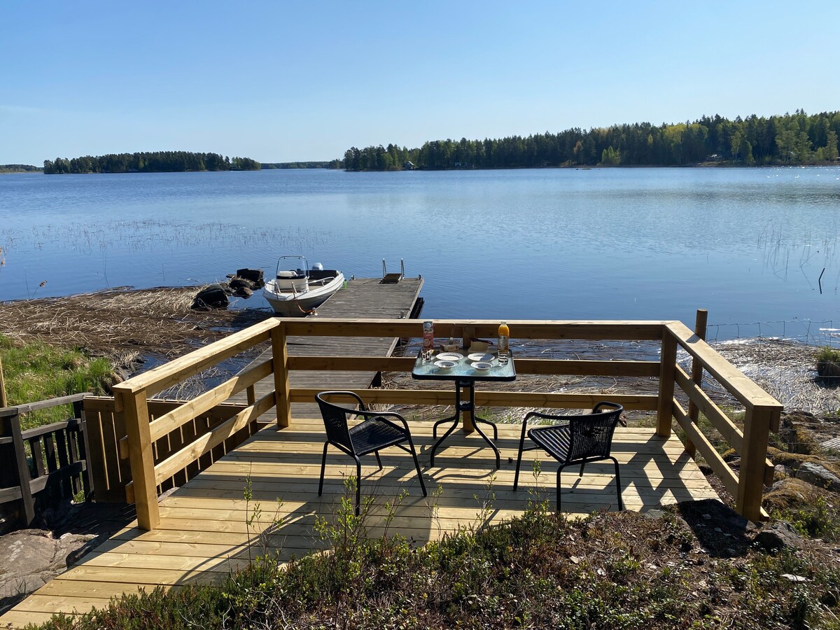 Private cabin on an island with a small motorboat