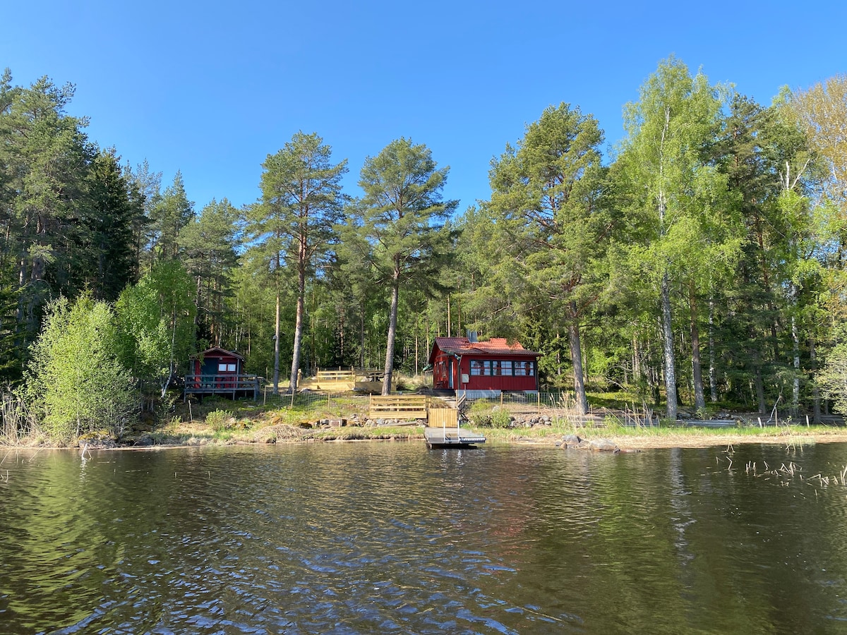 Private cabin on an island with a small motorboat