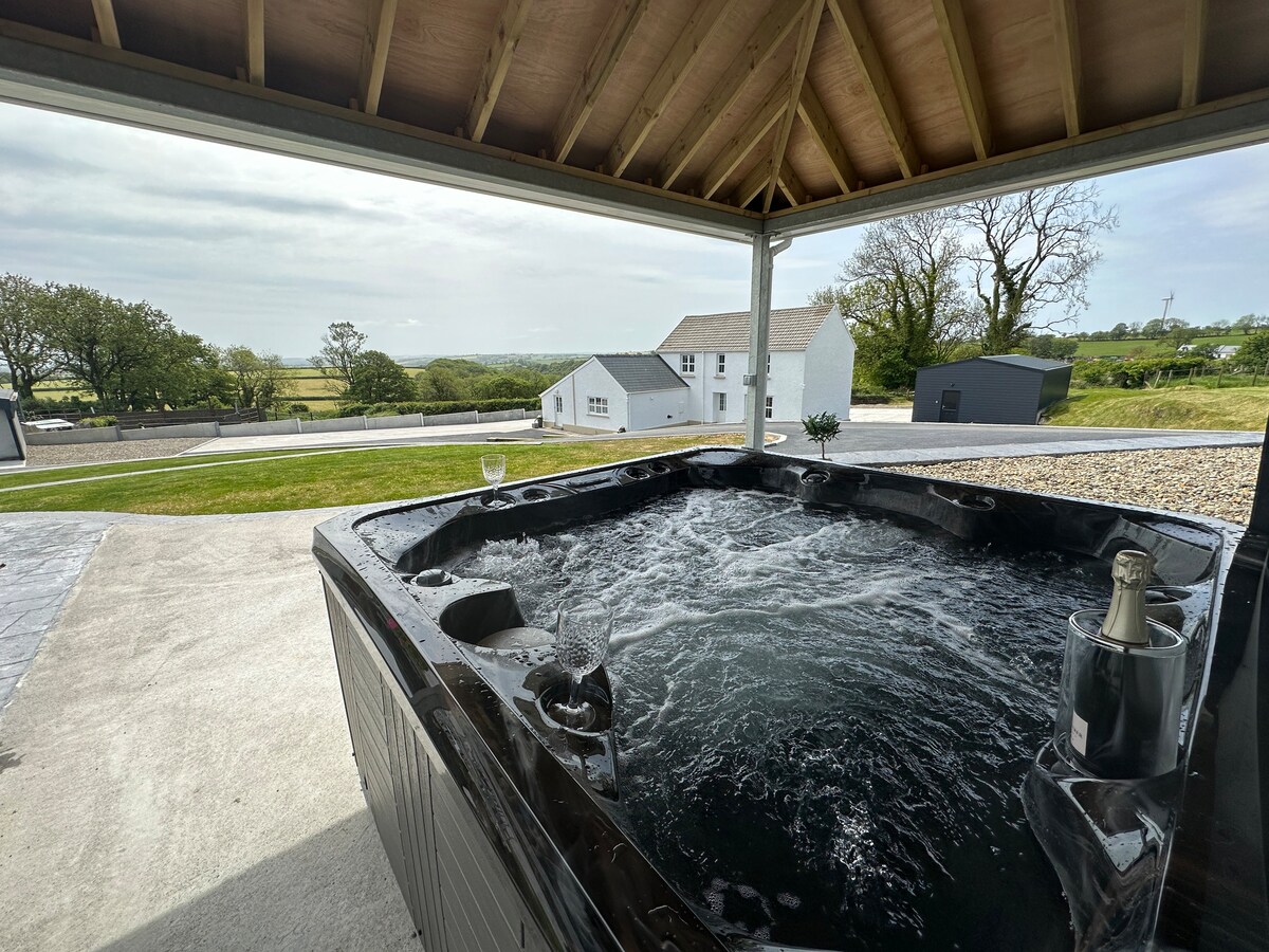 spacious farmhouse with hot tub and gardens
