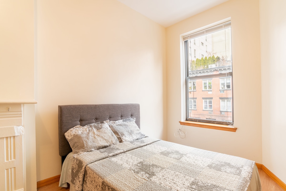 Spacious room with a kitchenette at West 30th St