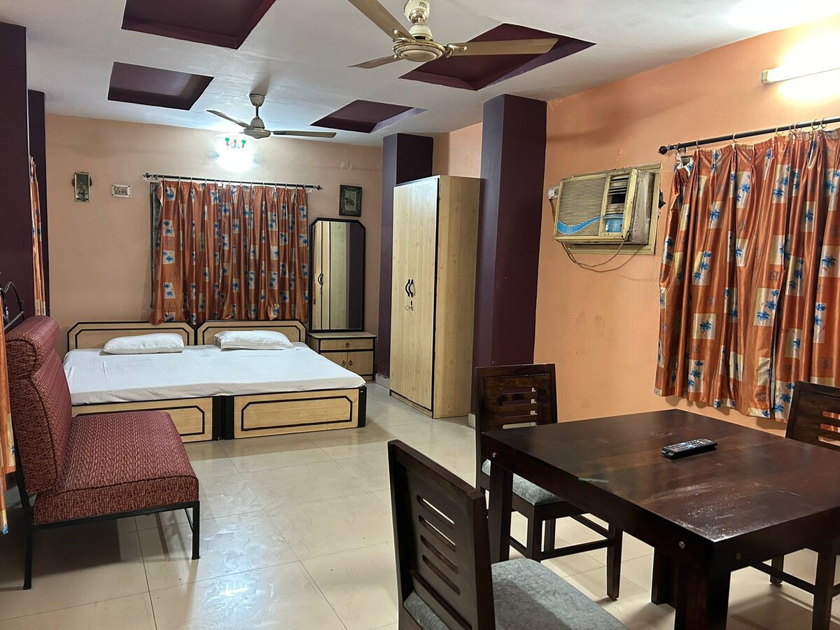 Furnished bedroom with kitchen
