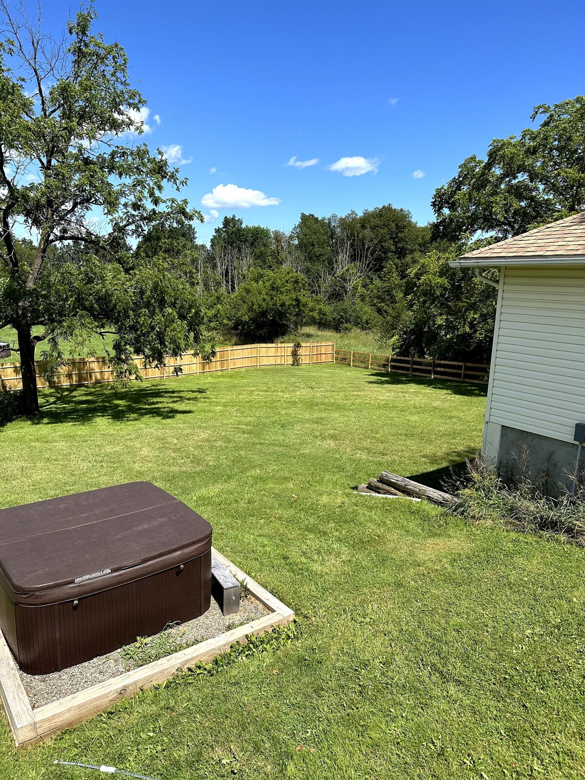 bungalow with a fenced yard next to minnewaska