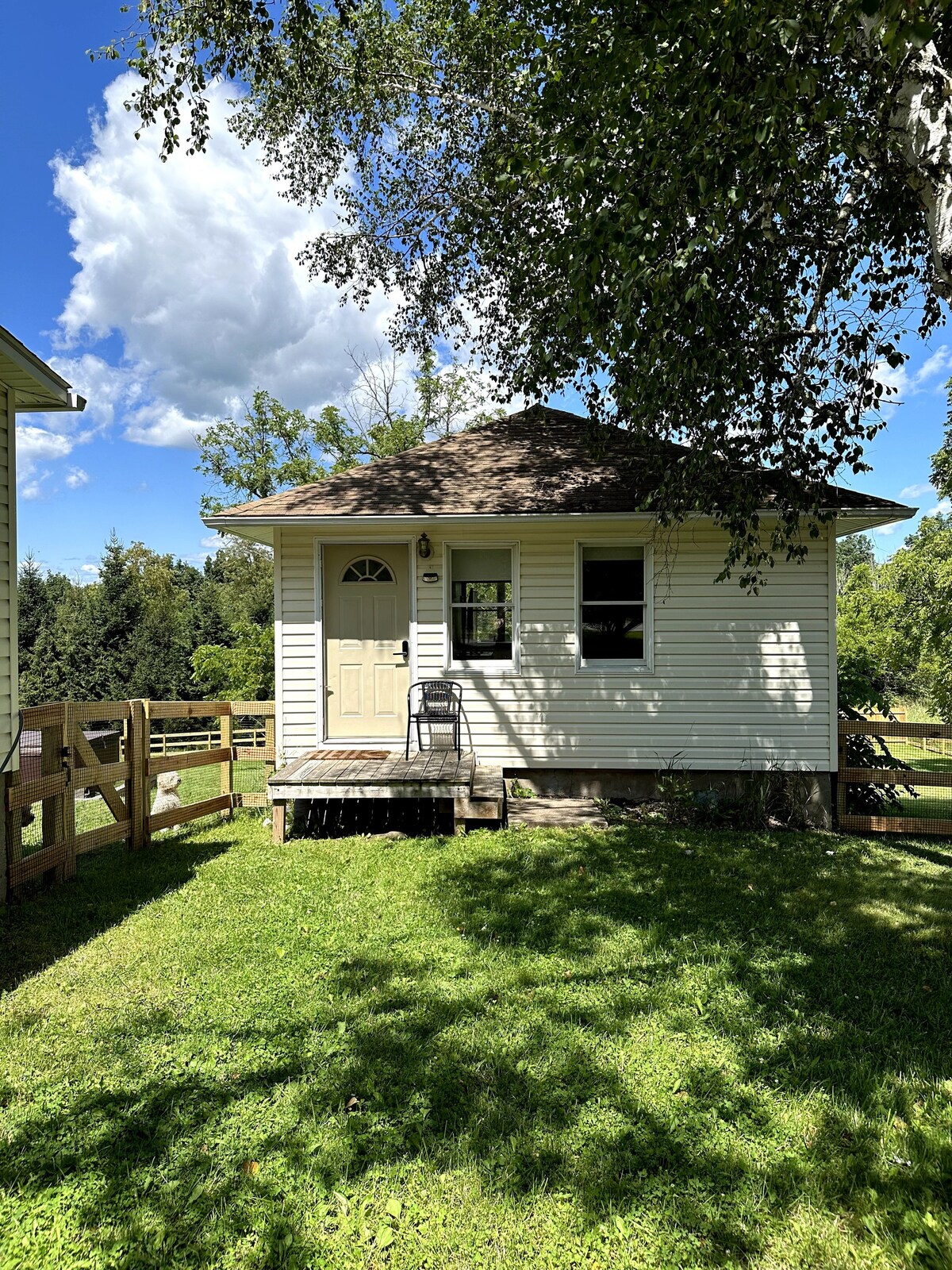 bungalow with a fenced yard next to minnewaska