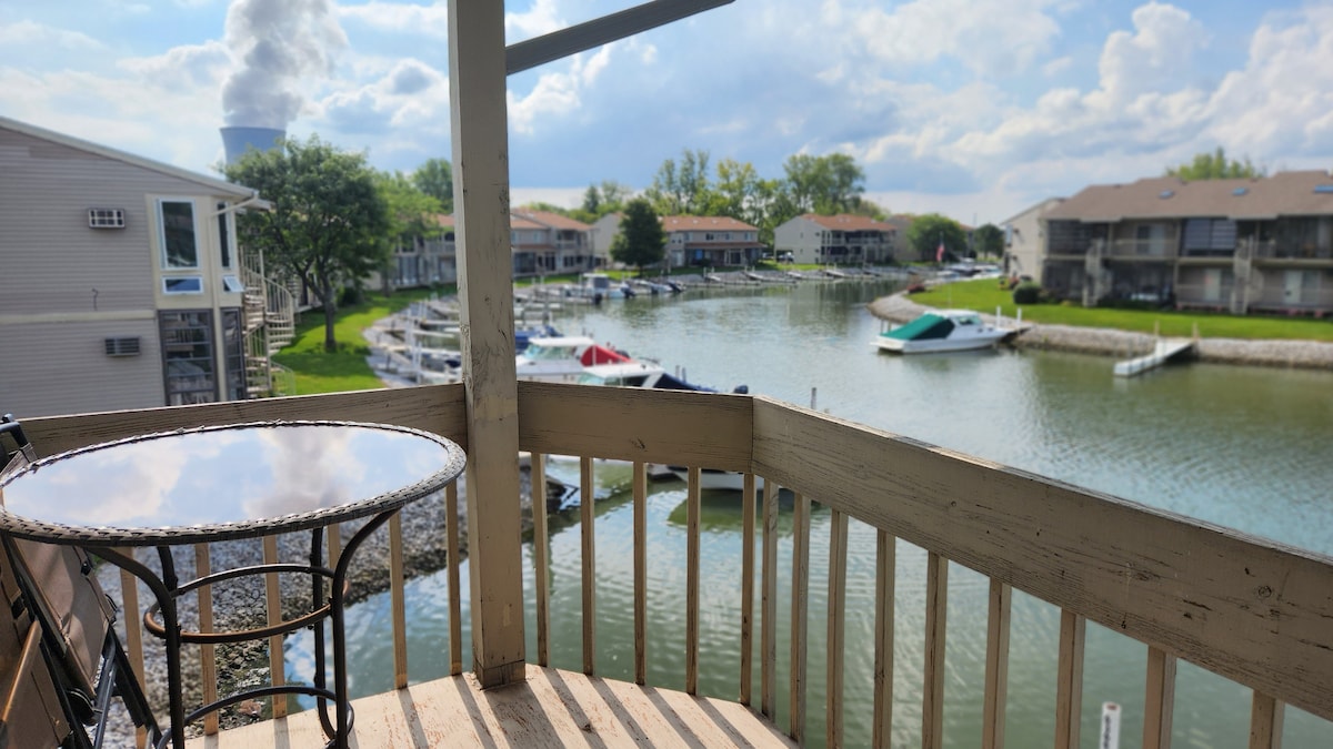 Gorgeous waterfront balcony view with a boat dock