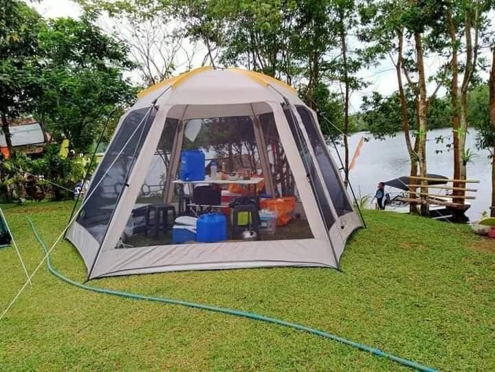 Tent Pitching on serene lake island in Laguna