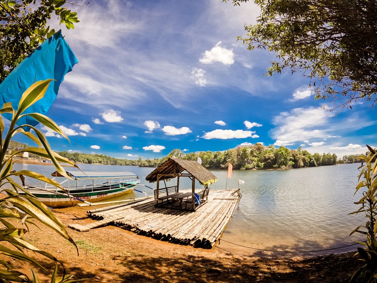 Tent Pitching on serene lake island in Laguna