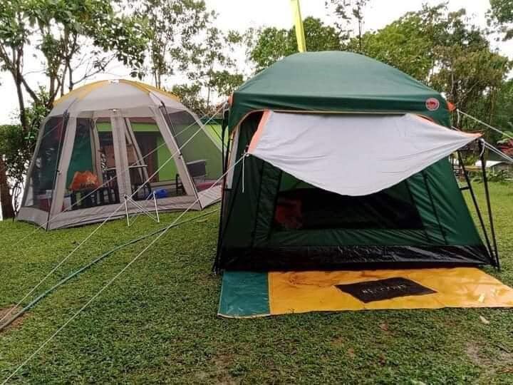 Tent Pitching on serene lake island in Laguna