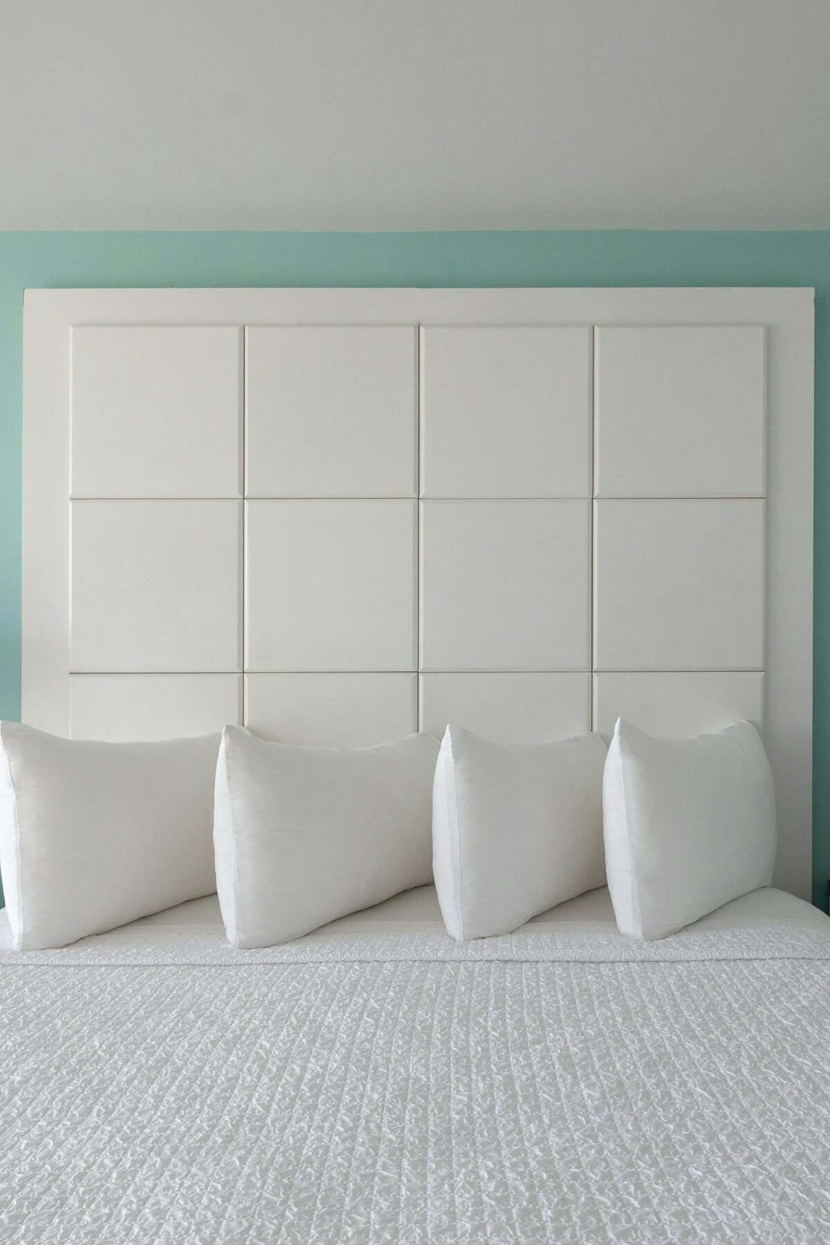 Furnished in crisp whites & calming blues/greens