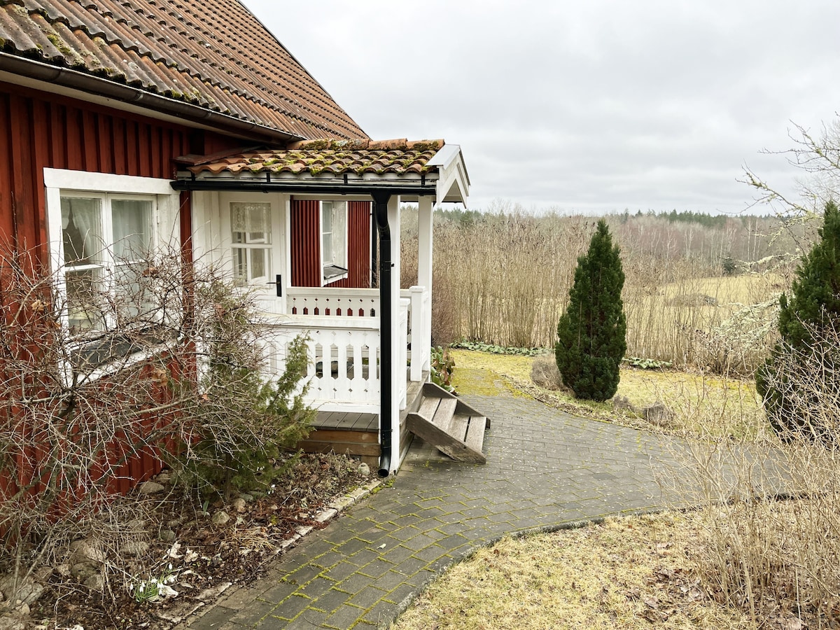 Red cottage with a nice view of the landscape, at